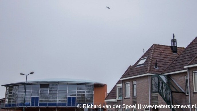 Politie heli boven het  Piet Mondriaan gebouw